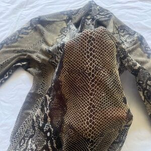 See-through snake print high neck blouse